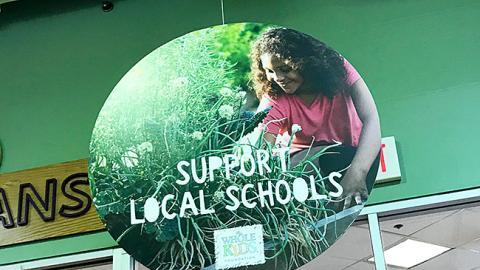 Whole Foods 'Support Local Schools' Ceiling Sign